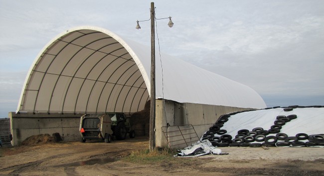 This former silo with fabric roof measures 40’x120’ and serves as hay storage in winter and lambing space in spring.